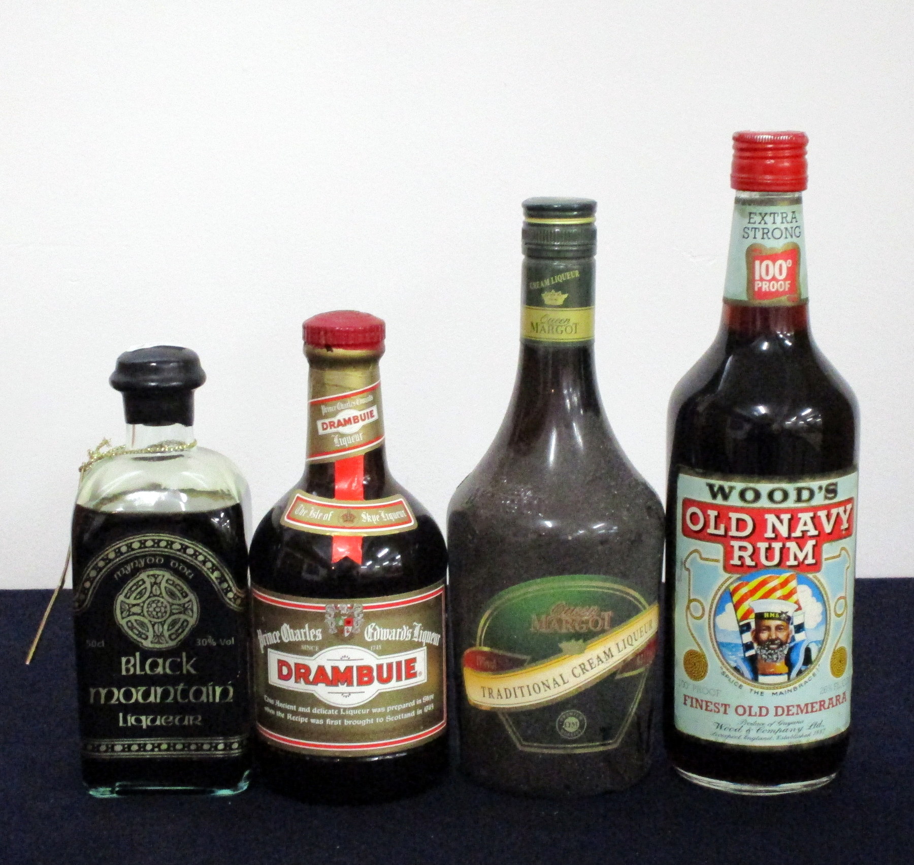 1 50- cl bt Black Mountain Liqueur 30% 1 50-cl bt Drambuie 40% 1 70-cl bt Queen Margot Traditional