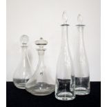 4 Assorted Decanters with stoppers including A Hand Blown Dom. Laroche Carafe