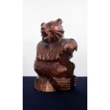 A Carved Wood Bottle Holder in the Form of a Bear