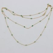 Collier mit Smaragden 585/- Gelbgold, gestemp. Gewicht: 7,1 g. 31 Smaragden im Rundschliff zu