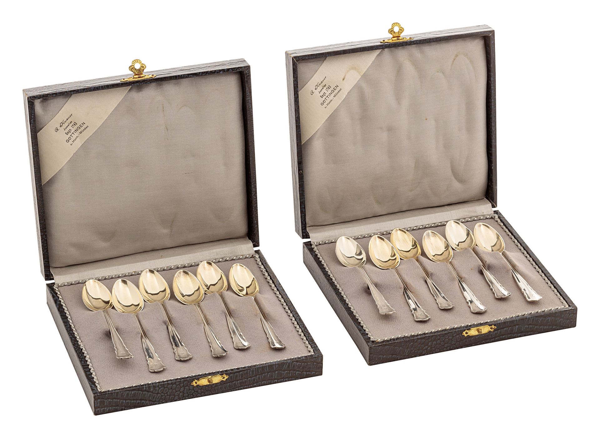 Twelve mocha spoons in cases