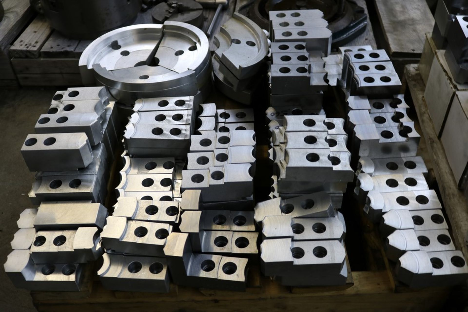 Pallet of Various Size Aluminum and Steel Jaws and Pie Jaws Used