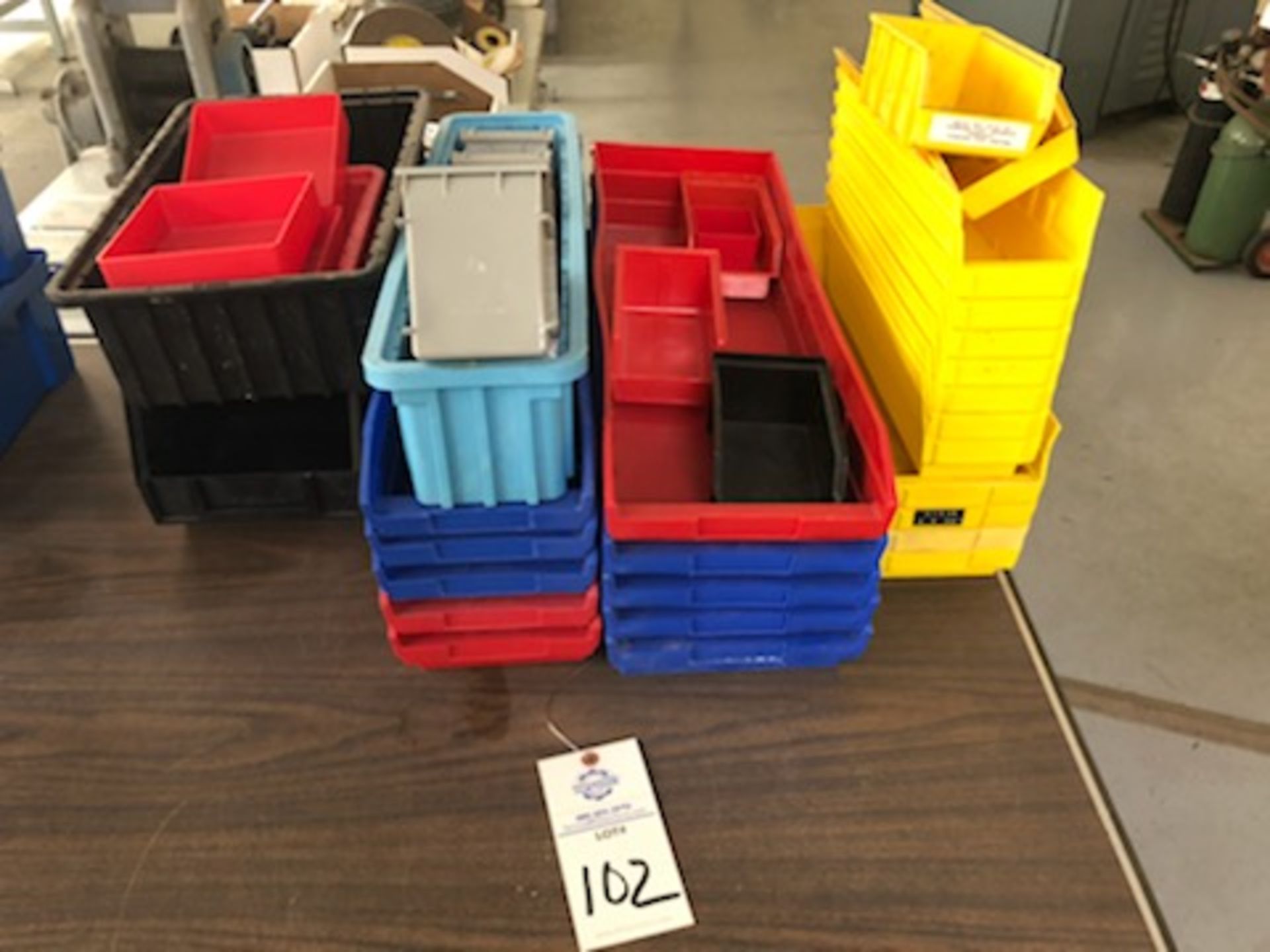 Assorted hard plastic parts bins in various sizes