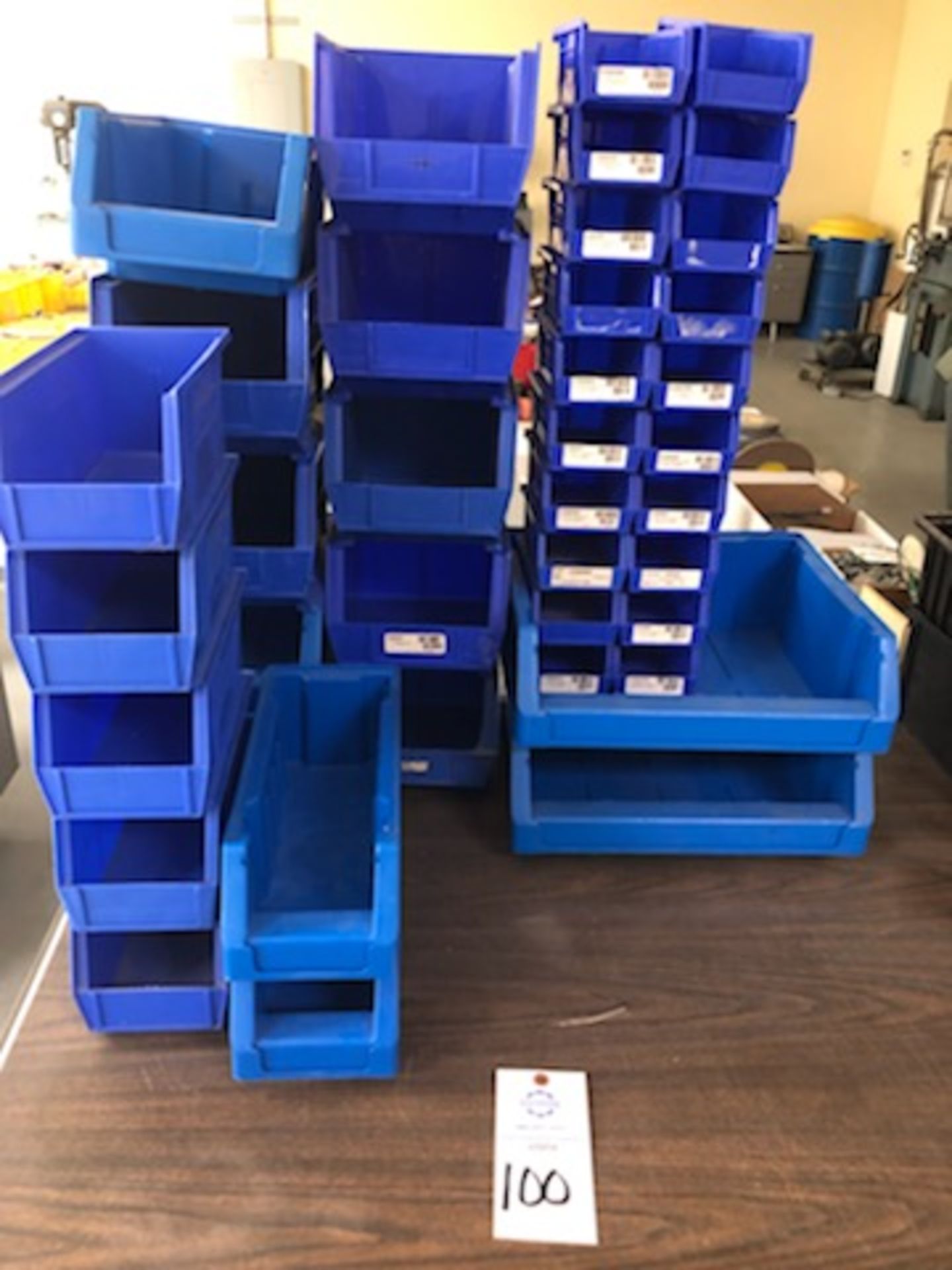 Assorted hard plastic blue parts bins of various sizes