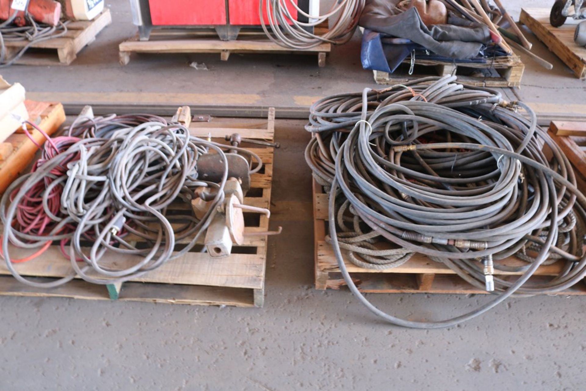 (2) pallets, 1 extension cords and vise, 1 rope and air hose pallet