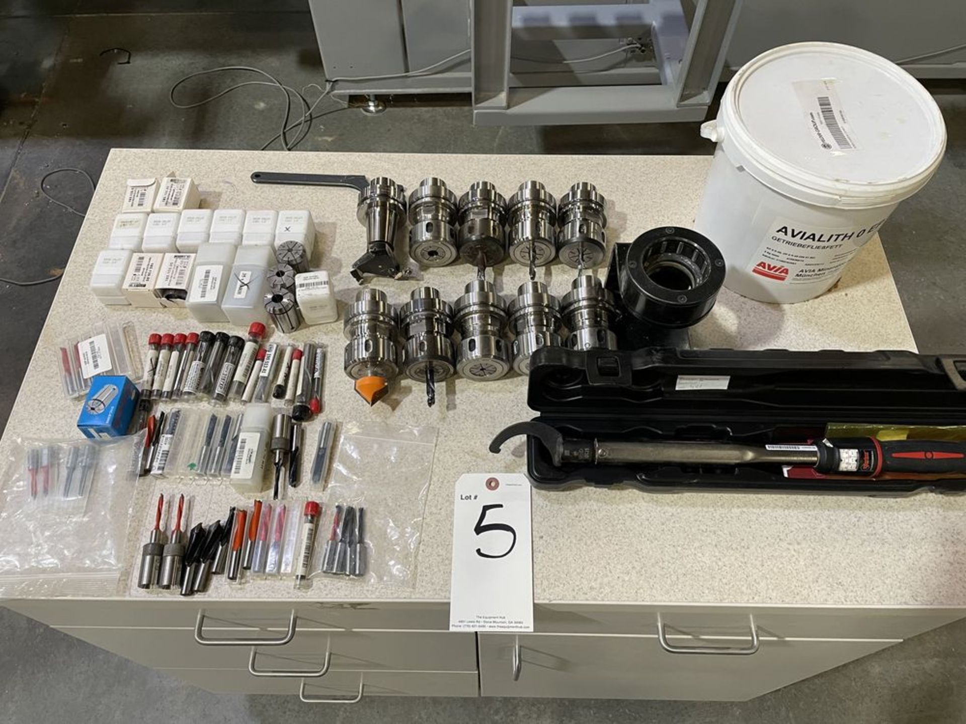 Lot of CNC Router Tooling and Cabinet. Includes HSK 63F tool holders, router bits, tool holder