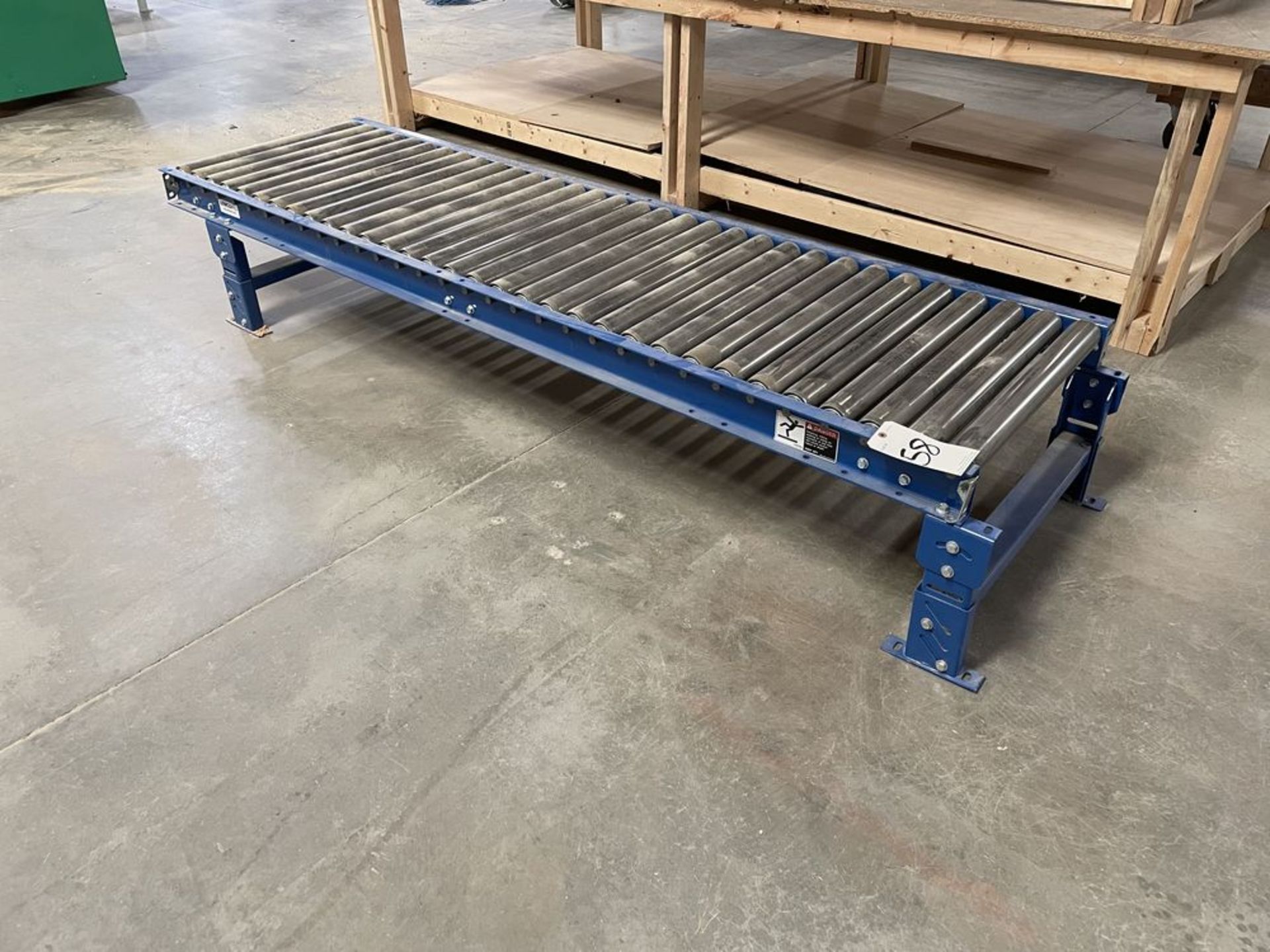 Lewco 8' Adjustable Height Roller Table. Equipped with 24" wide rollers, adjustable height legs to