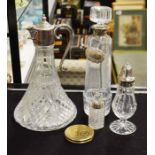 A silver mounted cut glass scent bottle and stopper, a decanter, a claret jug and further items