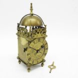 A brass lantern clock, brass chapter ring and bras