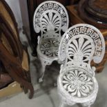 A Cast aluminium tete a tete garden table and chair