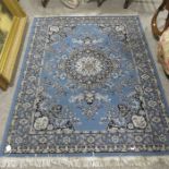 Two large Persian style rugs, blue and white flora