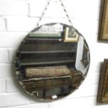 A bevel edged circular wall mirror,