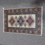 Three small Tribal Afghan style rugs, 135cm x 80cm