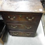 An early 19th Century oak chest of three short draw
