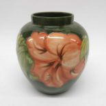 Walter Moorcroft, hibiscus on green pattern vase,