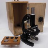 A microscope in fitted case, with multiple lens ma