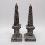 A pair of marble obelisks. square sectional form