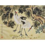 An Oriental watercolour of cranes on a silk panel,