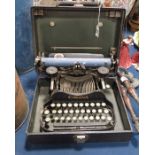 A Corona typewriter, cased.