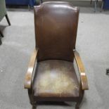 A 1920s upholstered open armchair