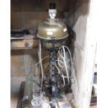 An Arts & Crafts style iron and brass table lamp,