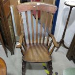 A Victorian slat back rocking chair
