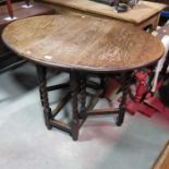 An oak gateleg dining table
