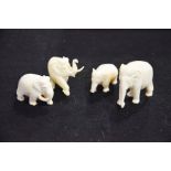 Four ivory elephant carvings