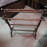 An Edwardian mahogany towel rail