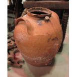 Two large terracotta storage vessels