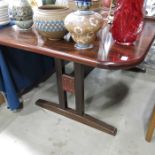 A mid century style rosewood veneered extending dining table