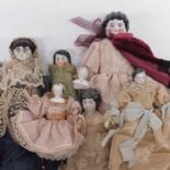 Six 19th Century porcelain head cloth bodied dolls