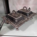 A twin compartmented silver plated entree dish and covers, square form