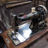 Two wooden cased sewing machines