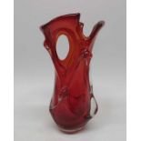 A large Murano glass vase, red cased, with oval ap