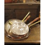 Five metal cased copper saute pans. (5)