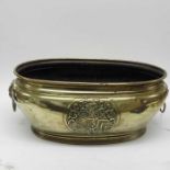 A Victorian brass jardiniere, oval section, applie