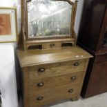 An Arts and Crafts oak dressing chest of three dra