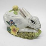 An Italian faience figural tureen and ladle, model