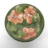 Walter Moorcroft, hibiscus on green pattern bowl,