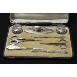 A George V silver manicure set, including silver t