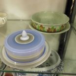 A Clarice Cliff strainer and stand, circular form,