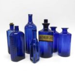 A blue glass apothecary bottle and stopper SYR HOR