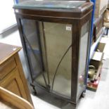 An Edwardian display cabinet on claw and ball feet