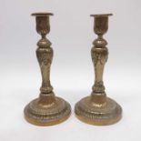 A pair of early 19th Century brass candlesticks, b