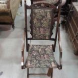 An Edwardian folding armchair