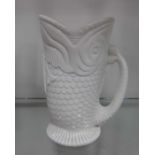A Sowerby style white pressed glass fish jug