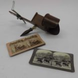A treen stereoscopic viewer together with five double plated slides of cows