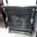A Victorian grotesque carved ebonised buffet, the