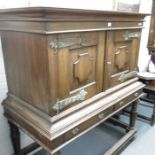 A Continental Chest on stand, twin panelled doors